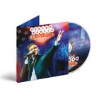 CD-Cover mit Schrift: „JULIEN DASSIN, L'AMERIQUE, LIVE USA“. Ein Mann singt leidenschaftlich in einem Anzug.