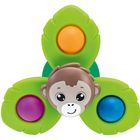 Text: "Fisher-Price." Ein Affenkopf in der Mitte dreier grüner Blätter, die bunte Kreise enthalten.