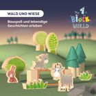 "WALD UND WIESE. Bauspaß und lebendige Geschichten erleben." Holztierfiguren und Bäume auf einer grünen Wiese.