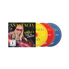 „ANASTACIA #NTK25 LIVE IN CONCERT“ in gelber Schrift. Cover zeigt Sängerin mit roter Brille, CDs in Gelb, Rot, Blau.