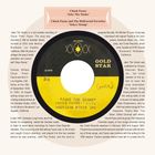 "Chuck Fayne 'Jake The Snake' b/w Chuck Fayne and The Hollywood Favorites 'Tokyo Stomp'." Eine Schallplatte mit Texten über die Aufnahme von "Jake The Snake" im Goldstar Studio in Los Angeles 1960.