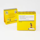 Adventskalender von Peter Gaymann mit 24 Postkarten für die Weihnachtszeit, auf gelbem Hintergrund mit Illustrationen.