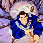 Keine lesbaren Texte erkennbar. Zwei Figuren in einer Felsschlucht, klettern mit einem Seil. Comicszene, energische Mimik.