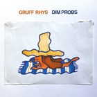 Text: "GRUFF RHYS DIM PROBS". Illustration: Ein Hund liegt auf einer gestreiften Decke unter einem großen gelben Hut.