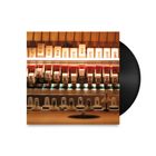 "Aphex Twin drukqs" steht auf Klavierteilen. Eine Vinyl-Schallplatte ist teils sichtbar.