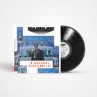 Schallplattenhülle mit "FELA FRESH CREW" oben, "TAKING CHARGE" in roten Buchstaben. Mann vor modernem Gebäude.