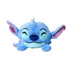 Blaues Plüschtier mit breitem Lächeln, großen Ohren, dunkelblauer Nase und geschlossenen, lachenden Augen.