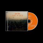 "Turnover - Down on Earth" in orange Schrift. CD Cover mit Menschenmenge, CD in leuchtendem Orange.