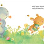 Text: "Bunny would hug her book and hop-hop in a book-happy dance, hip-hippity-hop." Illustration von Hasen in Blumenwiese.