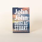 "John of John, Douglas Stuart, Booker Prize-winning author of Shuggie Bain" auf einem Buchcover mit wolkigem Hintergrund.