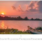 "Sonnenaufgang" Text, darunter Kalender für Januar. Landschaft mit Wasser, Boot, Pflanzen und strahlender Sonne am Horizont.