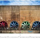"Duisburg Landschaftspark" steht unten. Große, farbige Industrieventilatoren - rot, blau, grün und blau - sind in einer Betonwand eingebaut.