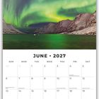 Text: "JUNE 2027." Kalender mit Nordlichtern über verschneiter Berglandschaft.