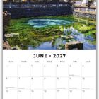 "JUNE 2027" steht zentral über einem Kalender. Oberhalb ein tropischer Tempel mit Palmen und Teich.