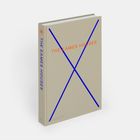 „THE EAMES HOUSES“ auf Buch; beige Hülle, blaue Linien kreuzen vorne, oranger Text.