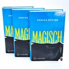 Drei Bücher stehen nebeneinander. Auf jedem Cover steht: "ANNIKA BÜSING MAGISCH". Darunter S. Fischer Logo.