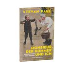 Aufschrift: "Stevan Paul, Monsieur, der Hummer und ich. Erzählungen vom Kochen. Nagel und Kimche.”  
Illustration: Ein Junge mit Hummer vor Koch.