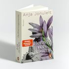 "Herbstvergessene" von Anja Jonuleit, Roman. Lila Blume, rotes "SPIEGEL Bestseller-Autorin" Label, Foto eines Babys.
