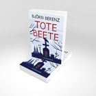 Text: "BJÖRN BERENZ, TOTE BEETE, Lübbe Kriminalroman." Cover zeigt Gräber, Krähen, Spaten vor grauem Himmel.