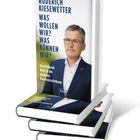 Buchtitel: "Was wollen wir? Was können wir?" von Roderich Kiesewetter. Abgebildeter Mann im Anzug, Bücherstapel.