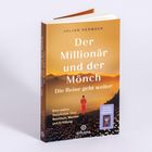 „Der Millionär und der Mönch: Die Reise geht weiter“ von Julian Hermsen. Goldener Himmel, Mensch in rotem Gewand.