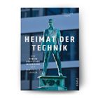 "Heimat der Technik" in großen weißen Buchstaben; Statue eines Mannes, darunter "VDI". Hintergrund: modernes Gebäude.
