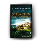 "Claire Edwards: Schatten über Korsika. Kriminalroman. Piper. Zwischen Bergen und Küsten ein Dorf in warmem Licht."