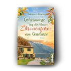 "Geheimnisse auf der kleinen Zitronenfarm am Gardasee" von Rebecca Martin. Illustration: Gelbes Haus, Zitronen, See, Berge.