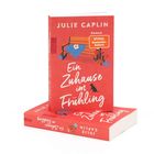 „Ein Zuhause im Frühling“ von Julie Caplin, rororo Roman. Illustration: Bank mit Wolldecke, Blumen, Katze.