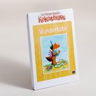 "Der kleine Drache Kokosnuss" und "Wundertüte" stehen auf einer Verpackung. Eine Illustration zeigt einen kleinen Drachen mit Büchern.