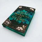 Ein mystisch gestaltetes Hardcoverbuch mit dem Titel "Witch of Darkness and Fortune" von Alexandra Fuchs.