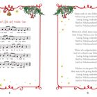 "Lasst uns froh und munter sein" mit Liednoten links, Liedtext rechts. Weihnachtliche Dekoration mit Zweigen und Glocken.