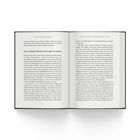 Ein Buch mit offenem Text: „Das irrationale Verhalten der Anleger hat System“. Thema: Verhaltensökonomie in der Finanzwelt.