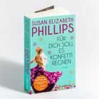 "Susan Elizabeth Phillips: Für dich soll es Konfetti regnen. Der neue Bestseller. Frau mit Blumenrock auf türkisfarbenem Cover."