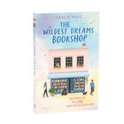 "GRACIE PAGE. THE WILDEST DREAMS BOOKSHOP. HIER FINDEST DU DIE LIEBE NICHT NUR IN GESCHICHTEN." Pastellfarbenes Gebäude.