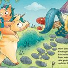 Ein Text erklärt, dass Einhörner beim ersten Kindergartentag Kuscheltiere und Familie mitnehmen. Illustration zeigt bunte Einhörner.