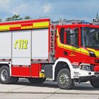 Ein rotes Feuerwehrauto mit gelbem Schriftzug „112“, „FEUERWEHR DORTMUND“ und „TECHNISCHE RETTUNG“.