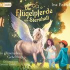 "Die Flügelpferde von Sternhall" zeigt ein geflügeltes Pferd mit Kindern im Wald, umgeben von magischen Lichtern.