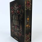 „ALINE ATMAN EVIL ELITE DER KODEX DER EHRE“. Verzierter Buchumschlag mit Rosen und dekorativen Ornamenten.