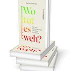 "Wo tut es weh?" in bunten Buchstaben, Buch von Rachel Zoffness, Thema: Schmertherapie, Verlag: Ullstein. Stapel mit Büchern.