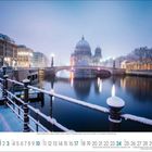 Text: Januar 1 2 3 4 5 6 7 8 9 10 11 12 13 14 15 16 17 18 19 20 21 22 23 24 25 26 27 28 29 30 31. Winter in der Stadt mit verschneiter Brücke und Dom.