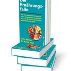 Buchtitel „Die Ernährungsfalle“. Unten Fotos von Lebensmitteln wie Pizza und Gemüse. Autoren: Julia Belluz, Dr. Kevin Hall.
