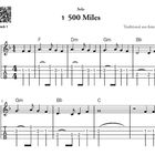 "1 500 Miles", "Traditional aus Amerika", "Track 1" links oben. Tabulatur für Gitarre mit Akkorden F, Dm, Gm, Bb, C.
