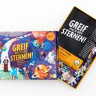 "Greif nach den Sternen! Ein Puzzle mit Weltraumheld*innen und Fun Facts." Box mit Astronauten im Weltraum-Design.