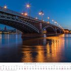 Der Rhein von Mainz bis Köln. Kalenderblatt Januar 2027. Abendliche Brücke über einem ruhig leuchtenden Fluss.