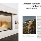 "Zeitloser Kontrast zur Energie der Straße" - Ein modernes Penthouse in Athen mit Glasfassade und urbaner Umgebung.