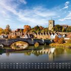 Text: "Aylesford 1". Eine malerische Szene mit einer alten Steinbrücke, Fluss, Fachwerkhäusern, Bäumen und einem Kirchturm.