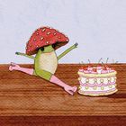Ein hüpfender Frosch mit Fliegenpilzhut, der in einer Spagat-Pose auf Holz zu einer Kuchen mit Kirschen nebenan springt.