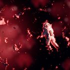 Keine sichtbaren Texte. Illustration: Ein Astronaut schwebt in einem Raum voller roter Trümmer.