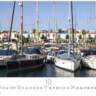 Text: "Puerto de Mogan", "CASARES EDITION".  
Kalenderbild mit Segelbooten im Hafen vor farbigem Gebäudereihe.